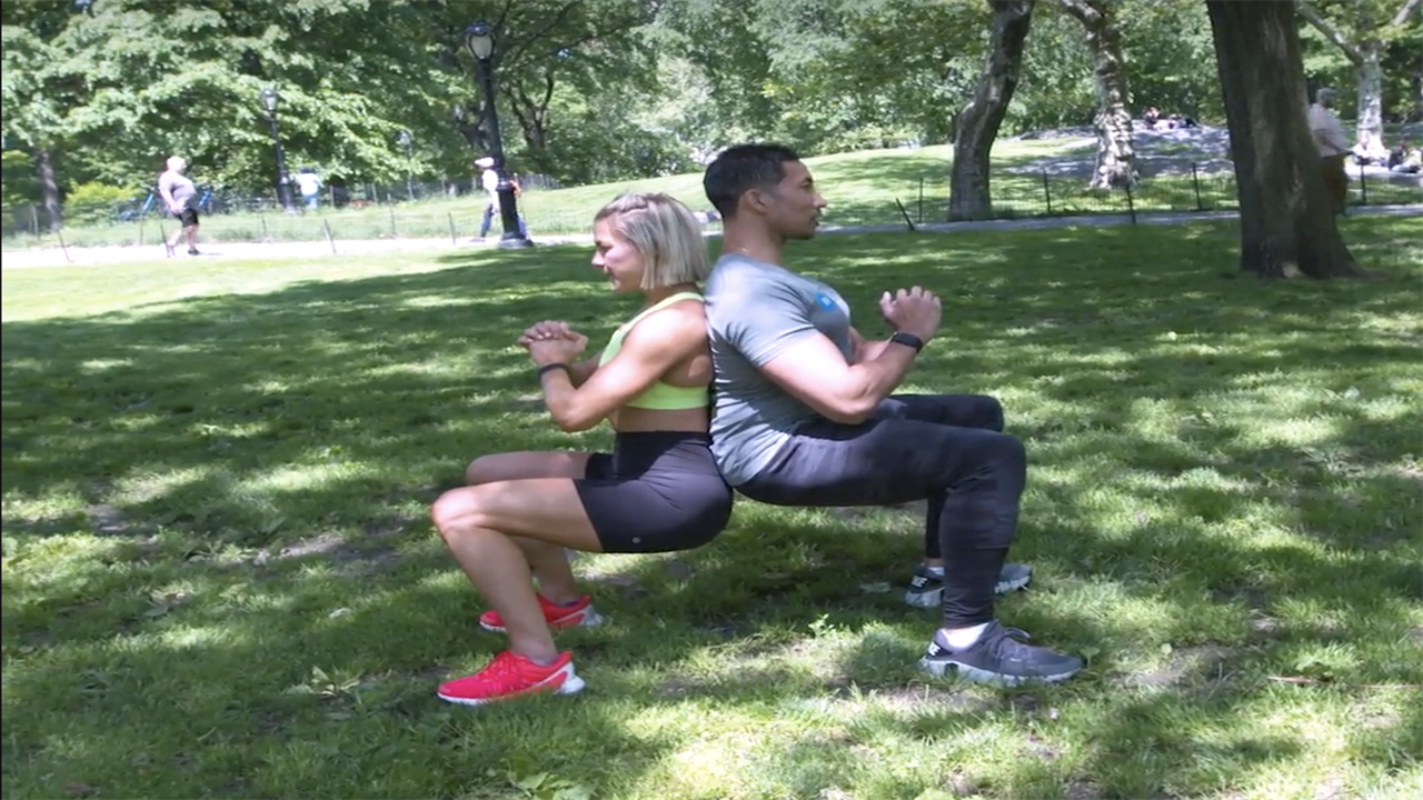 Try This Partner Wall Sit Workout for a Lower Body and Core Challenge